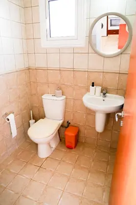 a bathroom with a toilet and a sink at Agesilaos Seaview 33 in Ayia Napa
