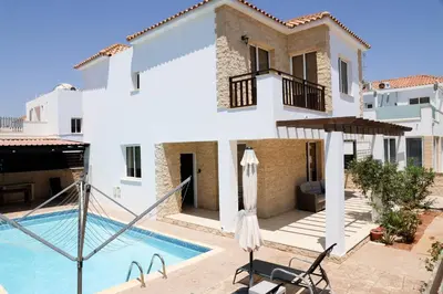 a view of a villa with a swimming pool at Agesilaos Seaview 33 in Ayia Napa