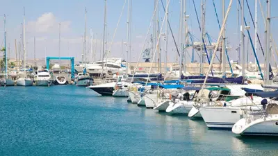 a bunch of boats are docked in a marina at Finikoudes Marina View #201 in Larnaka