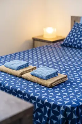 a pair of towels sitting on top of a bed at Central 2 bdr Flat St Lazaros - Phoenix Lodge in Larnaka
