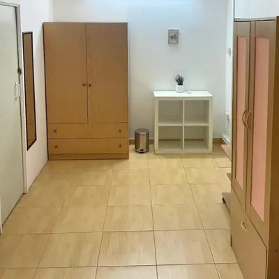 a room with a wooden floor and a cabinet at Comfortable Vacation House in Protaras