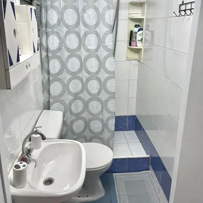 a small bathroom with a toilet and a sink at Comfortable Vacation House in Protaras