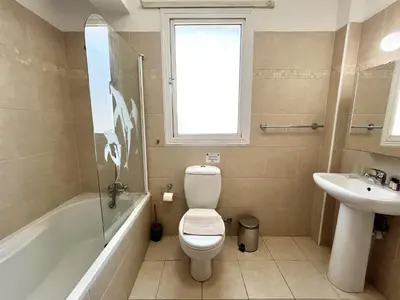 a bathroom with a toilet and a sink at STAY Sunny Palms Penthouse in Voroklini