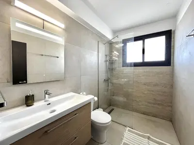 a bathroom with a sink and a toilet and a shower at STAY Sealine Apartment in Larnaka