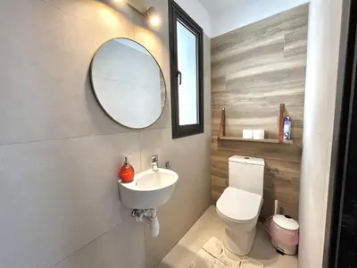 a bathroom with a sink and a mirror at STAY Sealine Apartment in Larnaka