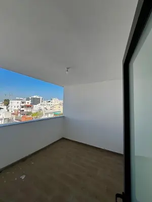 a large white room with a large window at Modern Designer Home in Larnaka