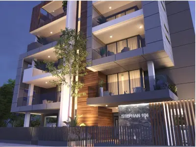 an apartment building with a sign in front of it at Modern Designer Home in Larnaka