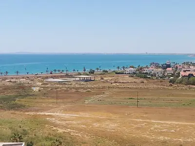 a view of the beach and the ocean at Caesar Socrates Apartment in Larnaka