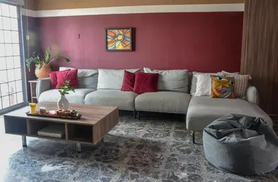 a living room with a couch and a table at The Family House in Larnaka