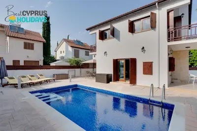 a villa with a swimming pool and a house at Amelia Beach Villa wpool -500mfrombeach in Voroklini