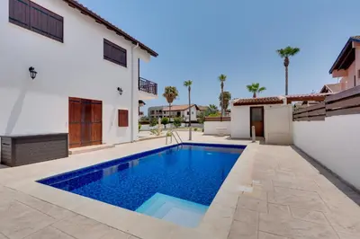 a swimming pool in the backyard of a house at Amelia Beach Villa wpool -500mfrombeach in Voroklini