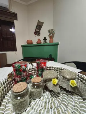 a table with jars and presents on a bed at Casa del Kampos in Kambos