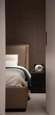 a bedroom with a bed and a dresser and a bed sidx sidx sidx sidx at Dest Retreat Beach & City Apt in Limassol
