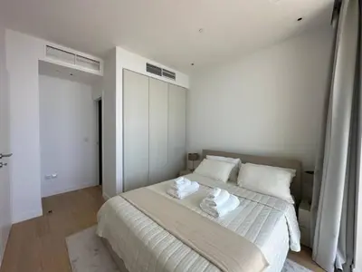 a bedroom with a large bed with two white pillows at Ayia-Napa Marina Luxury Appartments in Ayia Napa