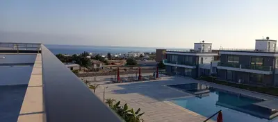 a view of a building with a swimming pool at Sunprime Premium Site in Pyla