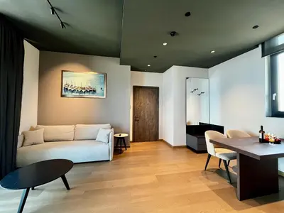 a living room with a couch and a table at STAY ONLY Tower Suites in Limassol