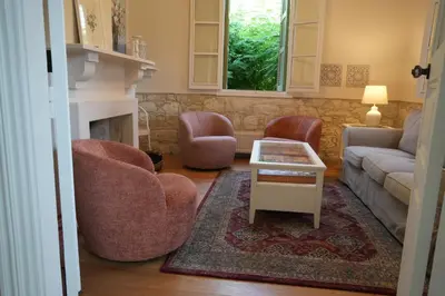 a living room with a couch and chairs and a table at Stou Savvide - Pera Pedi Stone Manor in Perapedhi