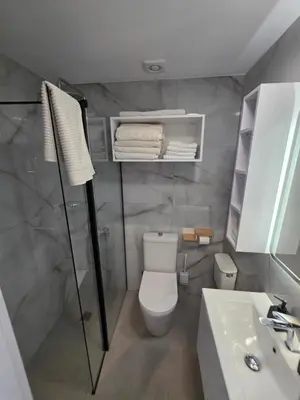 a bathroom with a toilet and a sink at Protaras Ayios Elias Maisonette in Protaras