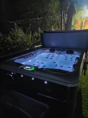 a ping pong table in a backyard at night at Protaras Ayios Elias Maisonette in Protaras