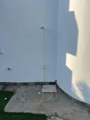 a building with a street light in the distance at Protaras entire house in Protaras