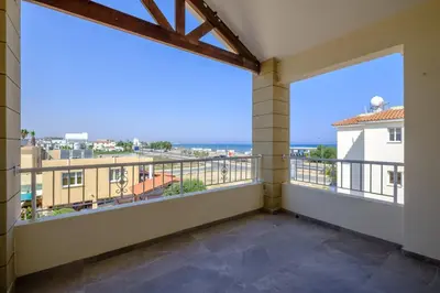 a balcony with a view of the ocean at Nautical Club Penthouse Apartments in Larnaka