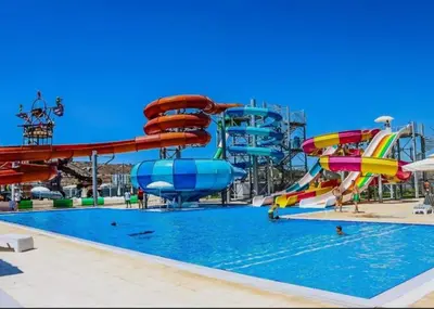 a water park with slides and a pool at One-Bedroom Apartment in Caesar Blue Complex in Protaras