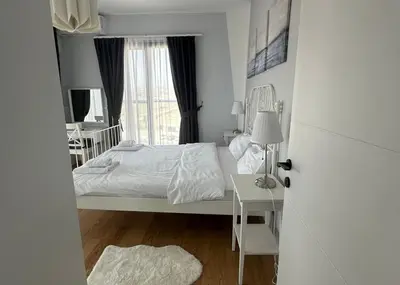 a white bedroom with a bed and a window at One-Bedroom Apartment in Caesar Blue Complex in Protaras