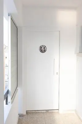 a white door in a room with a window at Napa Heights in Ayia Napa