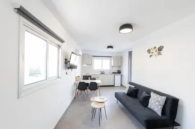 a living room with a couch and a table at Napa Heights in Ayia Napa