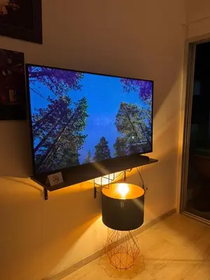 a large flat screen tv hanging on a wall at Sunny Escape, Protaras, Cyprus in Protaras