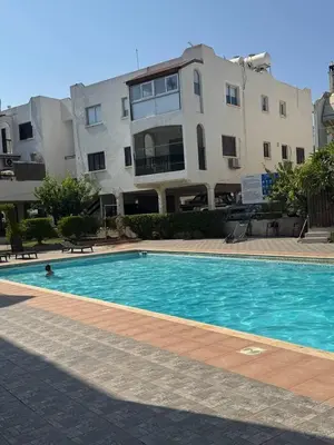 a large swimming pool in front of a building at Sunny Escape, Protaras, Cyprus in Protaras