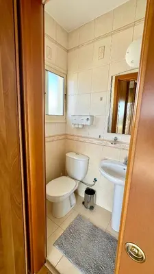 a bathroom with a toilet and a sink at Alkeou Holiday Home in Limassol