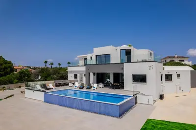a large white house with a swimming pool at Exclusive 7-Bdr Villa with Panoramic Views & Saltwater swimming pool! in Ayia Napa