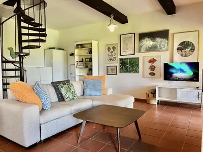 a living room with a couch and a tv at STAY Perla House in Protaras