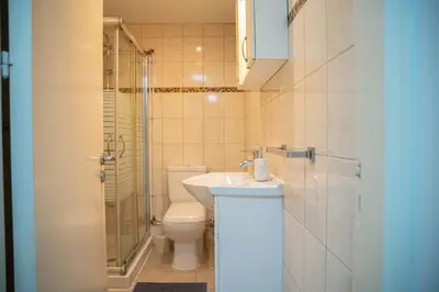 a bathroom with a toilet and a sink and a shower at ONAR mackenzie 1 in Larnaka