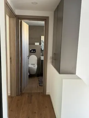 a bathroom with a toilet and a mirror at Great Escape -Holiday House in Larnaka