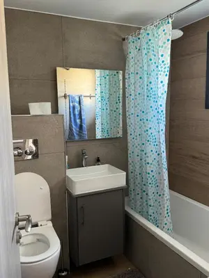 a bathroom with a toilet and a sink at Great Escape -Holiday House in Larnaka