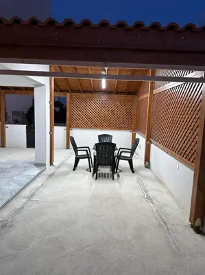 a table and chairs sitting on a patio at Great Escape -Holiday House in Larnaka