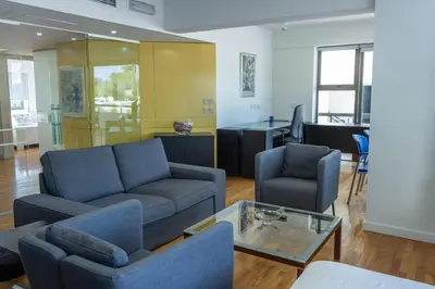 a living room with a couch and two chairs and a table at Cosy & Bright European Uni Apt in Strovolos