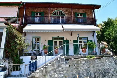 a house with stairs in front of it at Laouri Traditional 1-Bedroom in Kalopanayiotis in Kalopanayiotis