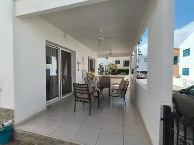 a balcony of a house with chairs and a table at Efterpis12 St. House in Paralimni