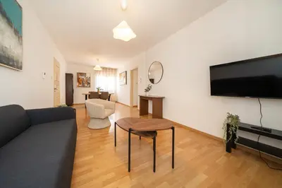 a living room with a couch and a table at 2 bedroom flat in city centre in Nicosia