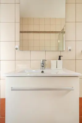 a bathroom with a sink and a mirror at 2 bedroom flat in city centre in Nicosia