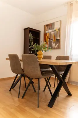 a dining room table and chairs in a room at 2 bedroom flat in city centre in Nicosia