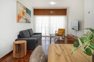 a living room with a couch and a table at Cozy 3 bedroom flat city center in Nicosia