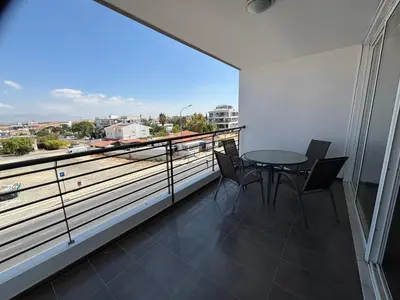a balcony with a table and chairs and a view at Michaela's place in Aglantzia