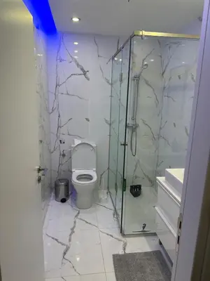 a bathroom with a toilet and a glass shower at Modern house in Larnaca in Larnaka