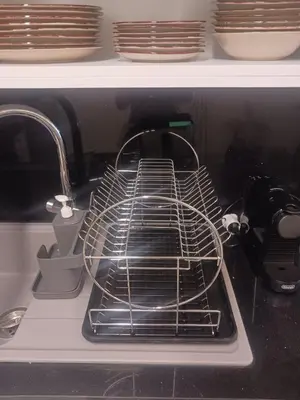 a dish drying rack in an oven with dishes at Lazuli Beachfront Sea View Ap 34 in Larnaka