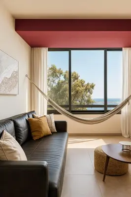 a living room with a couch and a large window at Larnaca Seaview Apartment with pool & parking in Larnaka