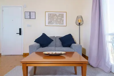 a living room with a couch and a coffee table at Central Penthouse Sky Suite in Nicosia